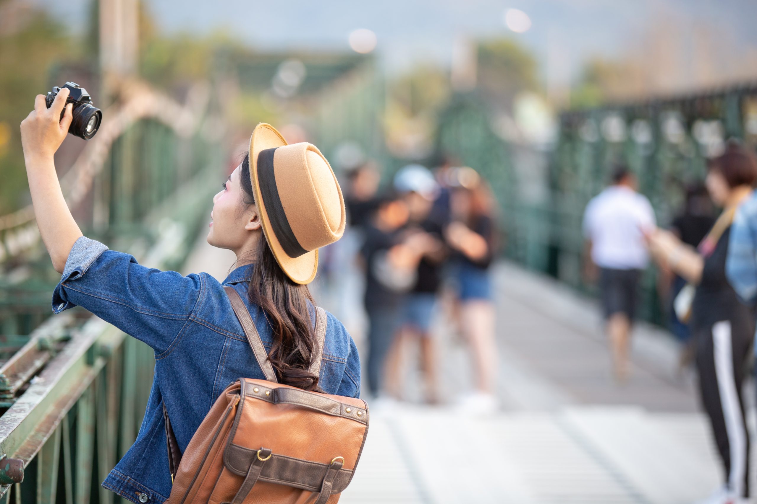 Female tourists who are taking photos of the atmosphere and smile happily.
